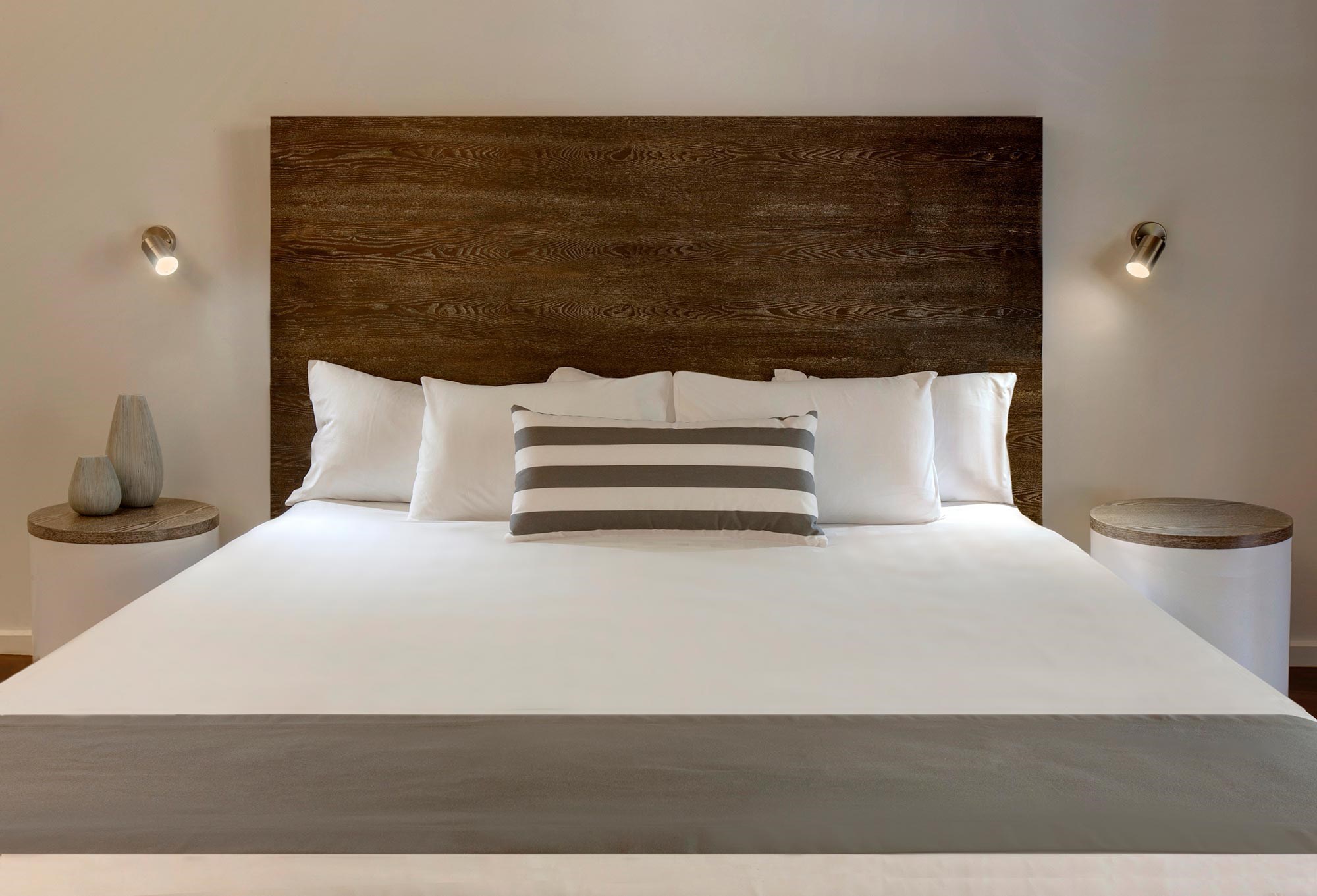 Bed in a Palm Bungalows Resort room Hamilton Island