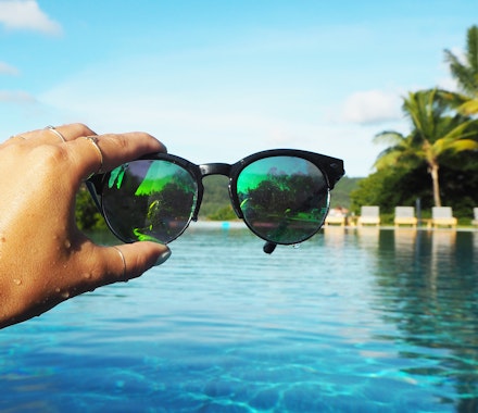 Lisa Hamilton SeeWantShop in pool at qualia holding sunglasses 