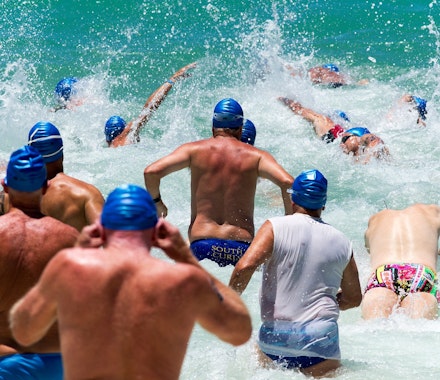 Swimmers taking part in the Hamilton Island triatlon - a famous sporting event in the Whitsunday Islands visited annually by many people who have chosen to spend their summer vacation there