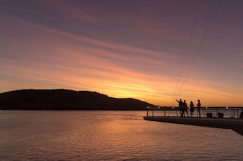 Watch the sunset from Bommie Deck at the Yacht Club - Hamilton Island family holidays