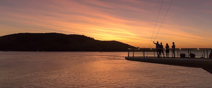 Watch the sunset from Bommie Deck at the Yacht Club - Hamilton Island family holidays