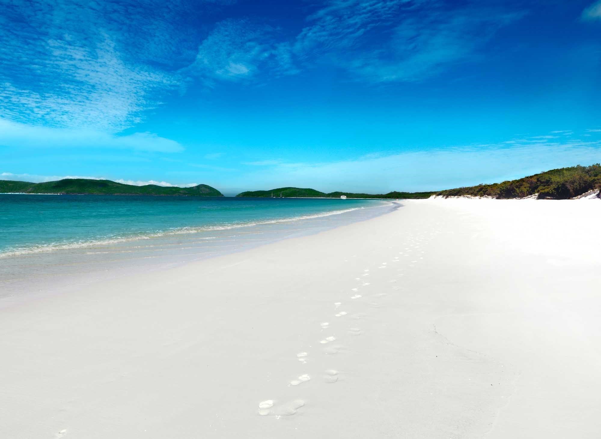 Relax with a swim on Whitehaven Beach - Hamilton Island luxury holidays 