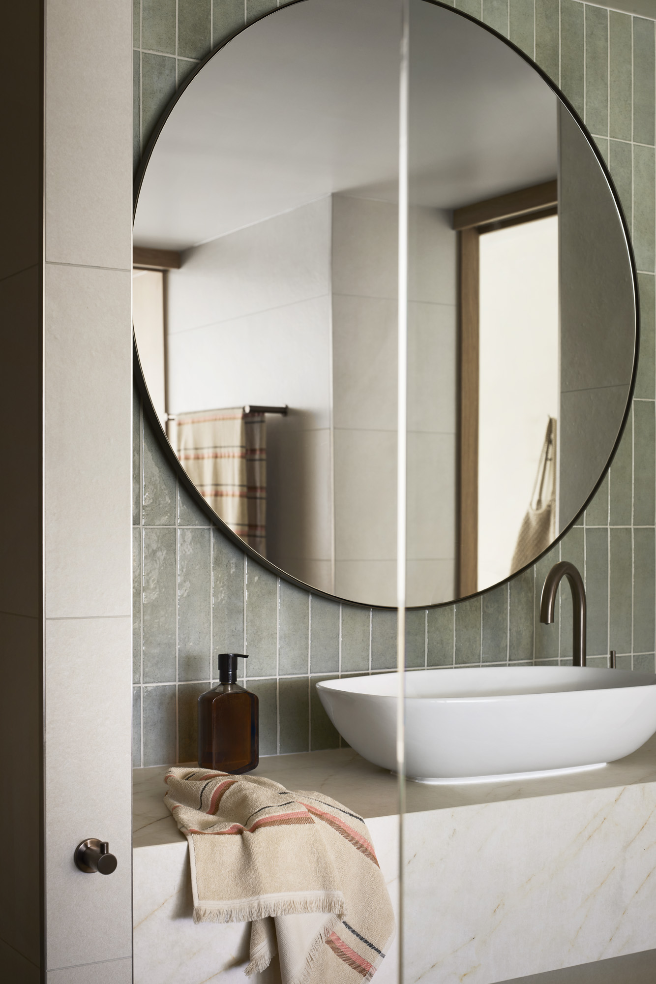 Bathroom sink and mirror at The Sundays - A new boutique hotel for families on Hamilton Island in the heart of the Whitsundays and the Great Barrier Reef.