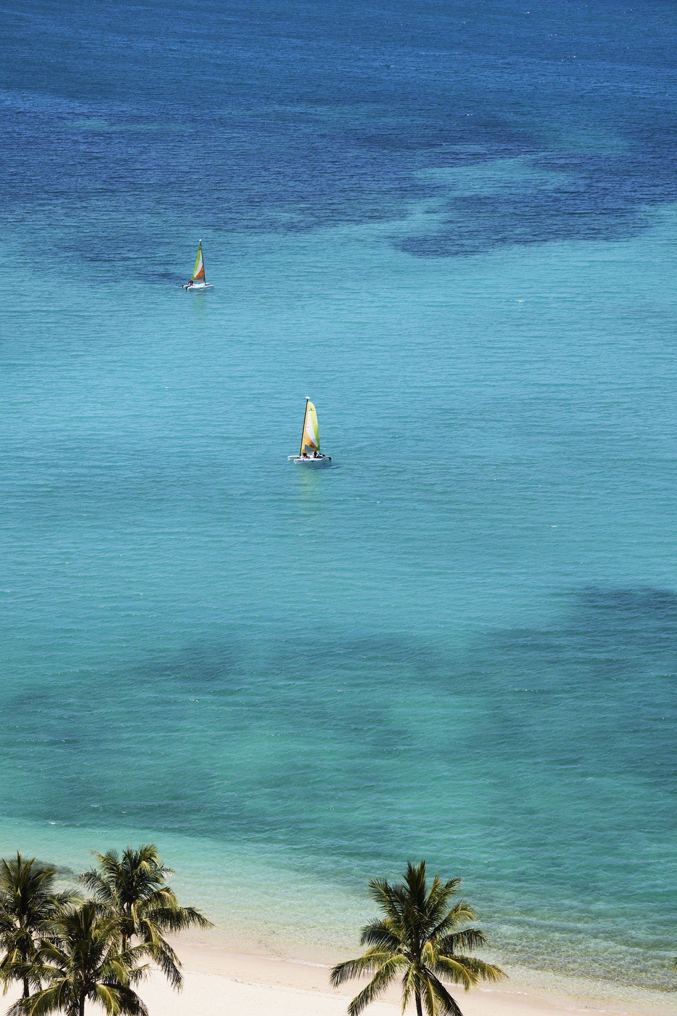 Sailaway on a catamaran off Catseye Beach at The Sundays - Hamilton Island's new family friendly boutique hotel in the heart of  the Great Barrier Reef.